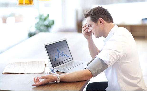 How to Check Your Blood Pressure 6 mid adult man checking his blood pressure at home 27994 How to Check Your Blood Pressure - 3