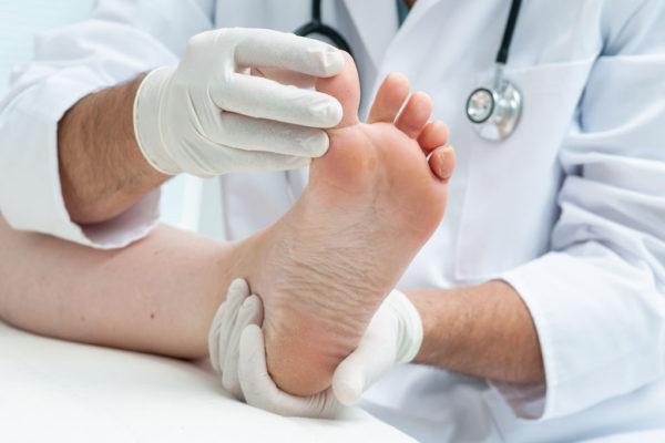 Onychomycosis Infection: Causes, Symptoms, Treatments and Possible Preventions 2 doctor examines patient foot Onychomycosis Infection: Causes, Symptoms, Treatments and Possible Preventions - 2 Onychomycosis Infection